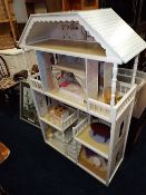 A large kiddi craft dolls house with furnishings