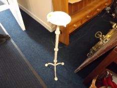 A floor standing candle holder