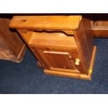 A pine bedside cabinet