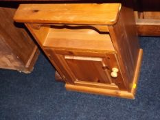 A pine bedside cabinet