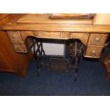 An antique sewing machine & table