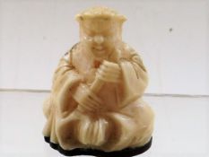 A small ivory netsuke style figure