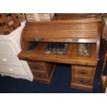 An early 20thC. tambour topped desk