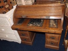 An early 20thC. tambour topped desk