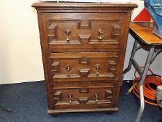 A Gothic revival style deep chest of oak drawers