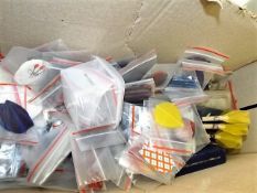 A boxed quantity of mostly dart flights & stems