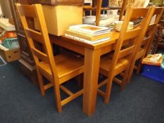 A branded heavy oak table & six dining chairs