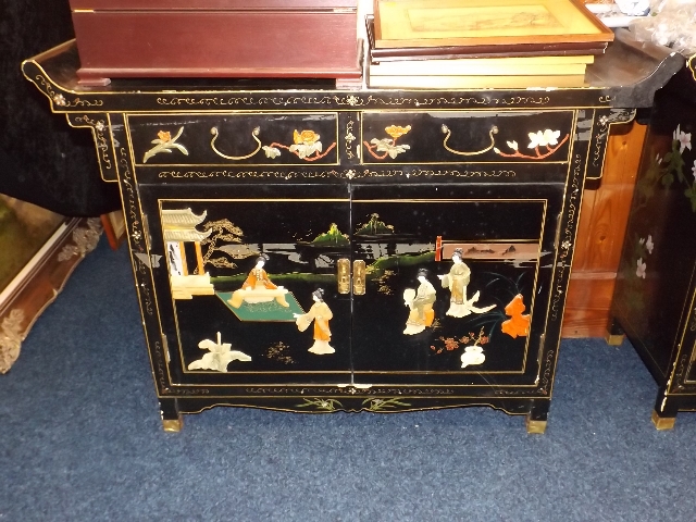 A Chinese side board with applied decor