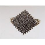 A ladies 9ct gold diamond cluster ring