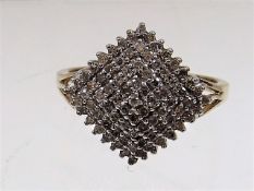 A ladies 9ct gold diamond cluster ring