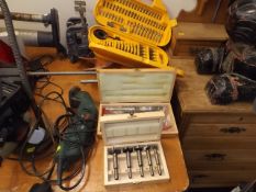 A Bosch sander & three boxes of various drill bits