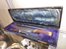 A horn handled boxed carving set