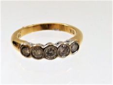 A ladies five stone 18ct diamond ring