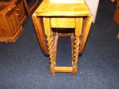 A honey oak barley twist gateleg table