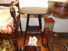 A small occasional table with carved top