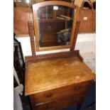 A small oak dressing table with mirror