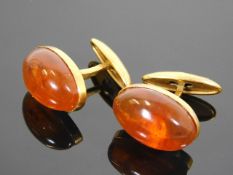 A pair of Russian yellow metal cufflinks with ambe