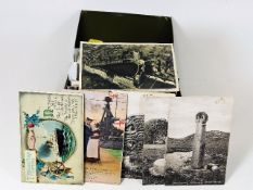 A boxed quantity of postcards including some of Co