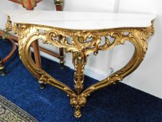 A gilt wood marble topped demi lune