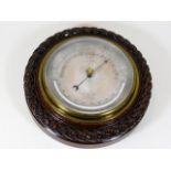 A J. Hicks maker London brass barometer in carved