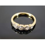 An 18ct gold five stone diamond ring