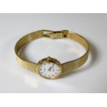 A 9ct gold ladies Tissot wrist watch