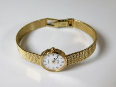A 9ct gold ladies Tissot wrist watch