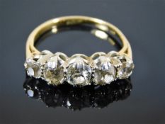 An 18ct gold five stone ring with approx. 1ct diam