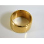 A yellow metal wedding band