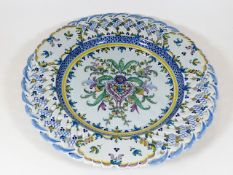 A continental faience charger of reticulated desig
