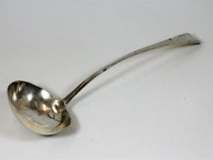 A silver Georgian ladle with old repair