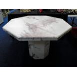 An octagonal marble dining table