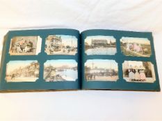 An early 20thC. postcard album containing many cards depicting Shanghai China, Russia, Ceylon & othe