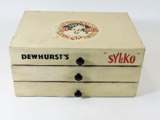 A Dewhurst's sylko box with some contents