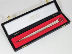 A boxed silver letter opener