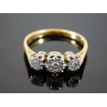 An 18ct gold diamond trilogy ring