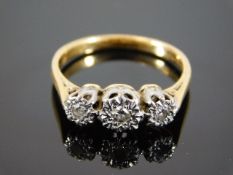 An 18ct gold diamond trilogy ring
