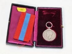 A boxed faithful service medal awarded to John Who