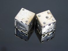 A pair of silver dice