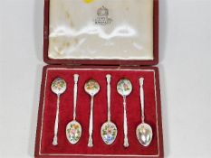 A set of six enamelled silver spoons, one a/f in A