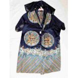 A Chinese silk gown with detailed embroidered roundels featuring Imperial dragons & Taoist swastika