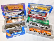 Twelve boxed Corgi diecast trucks