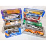 Twelve boxed Corgi diecast trucks