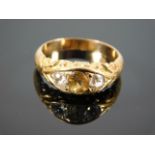 A yellow metal antique gold ring set with diamond