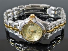 A ladies two tone Burberry quartz wrist watch