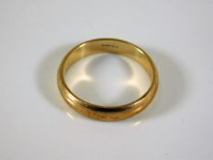 A 9ct gold wedding band