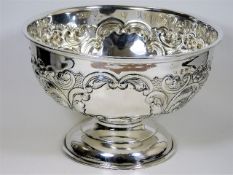 An English silver rose bowl with organic relief de