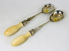 A pair of ivory & white metal salad servers with Oriental marks