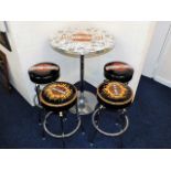 A Harley Davidson bar table with stools