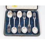 A boxed set of silver spoons with ecclesiastical h